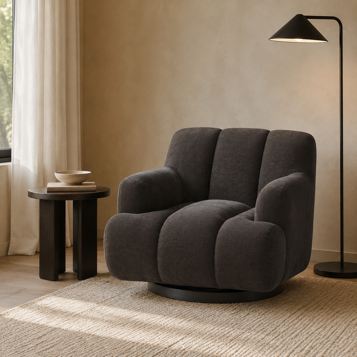 Made to order charcoal swivel armchair in a contemporary reading corner