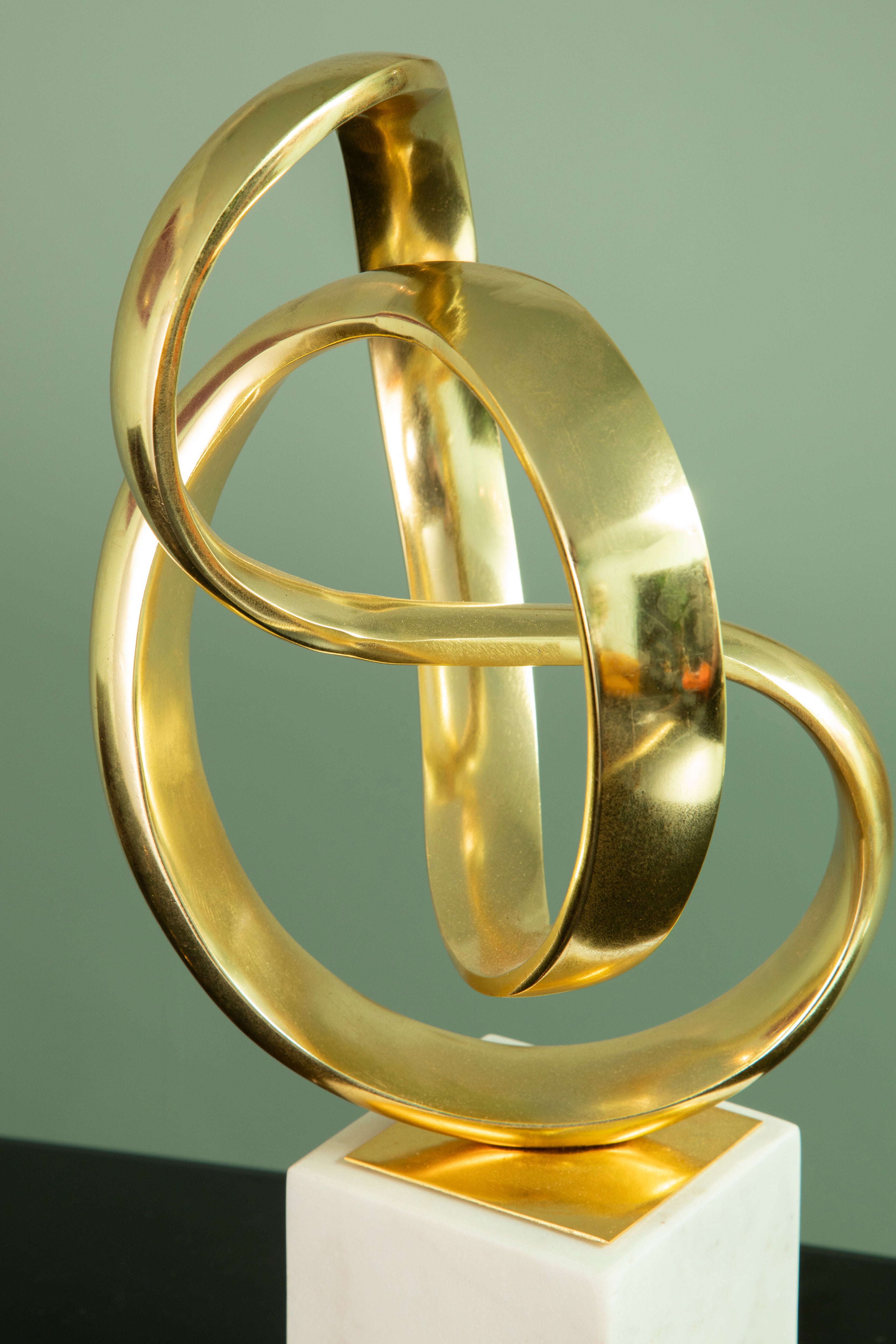 Cleo Gold Nickel Finish Knot Sculpture on White Marble Base