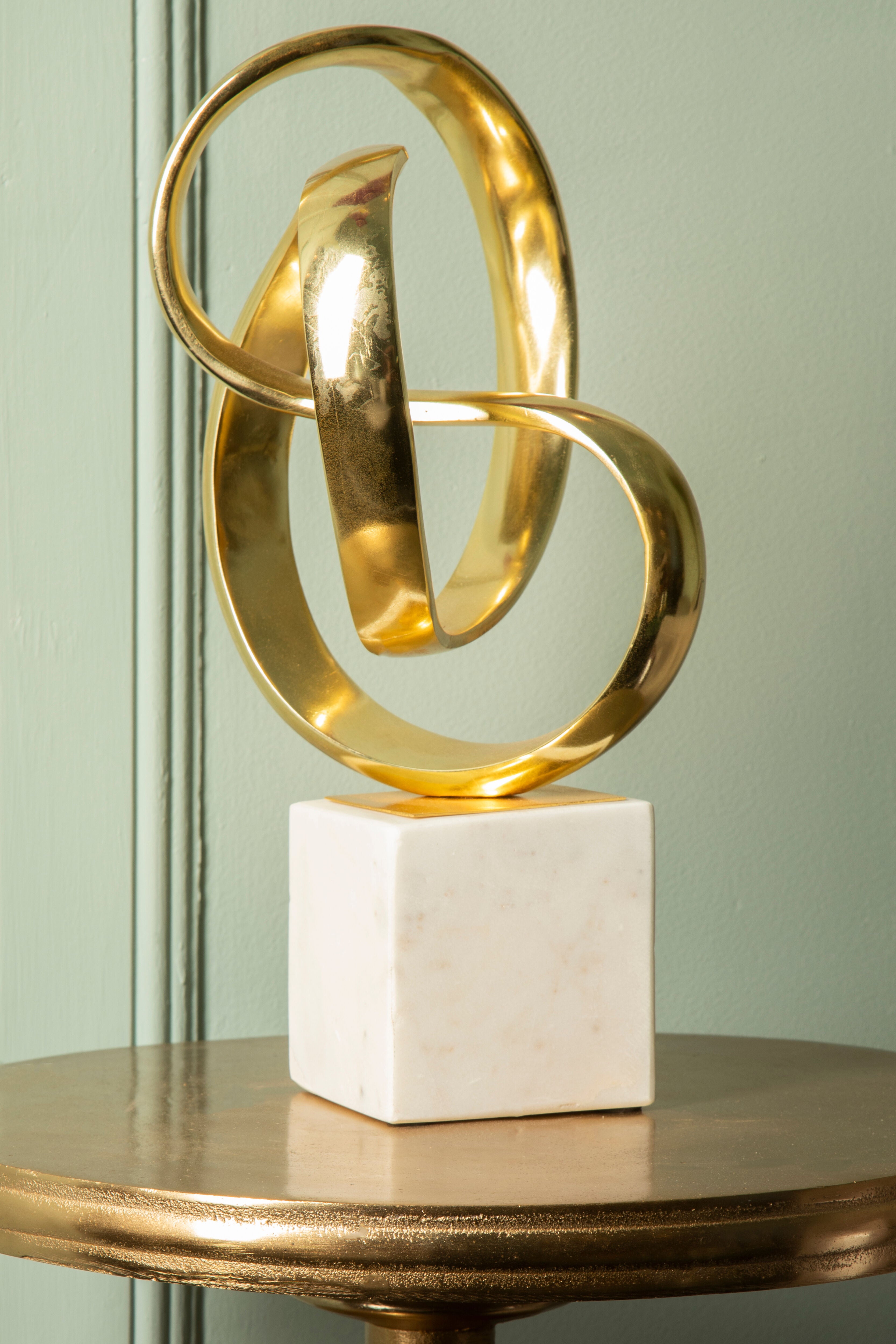 Cleo Gold Nickel Finish Knot Sculpture on White Marble Base