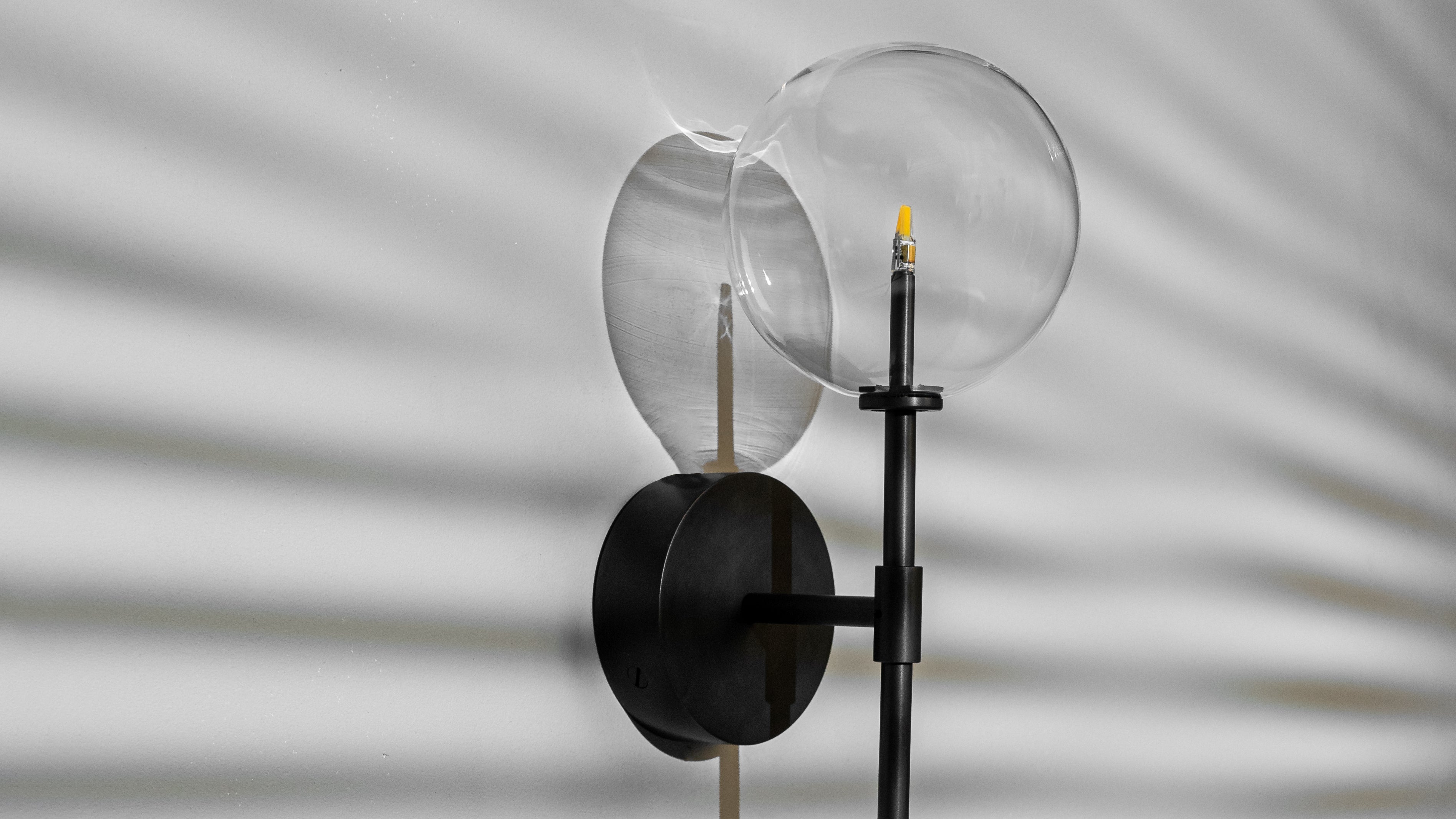 Schwung Dawn Single Black Gunmetal Transparent Globe Wall Light