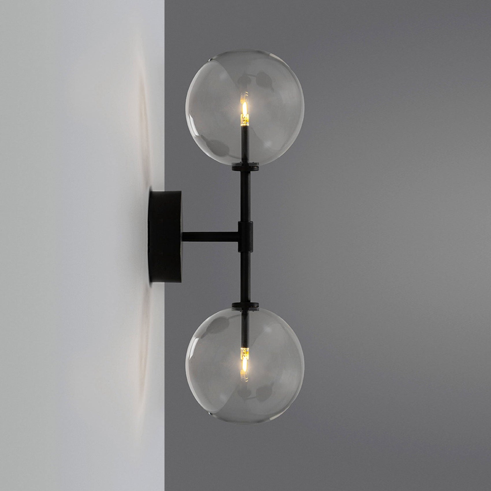 Schwung Dawn Dual Black Gunmetal Transparent Globe Wall Light