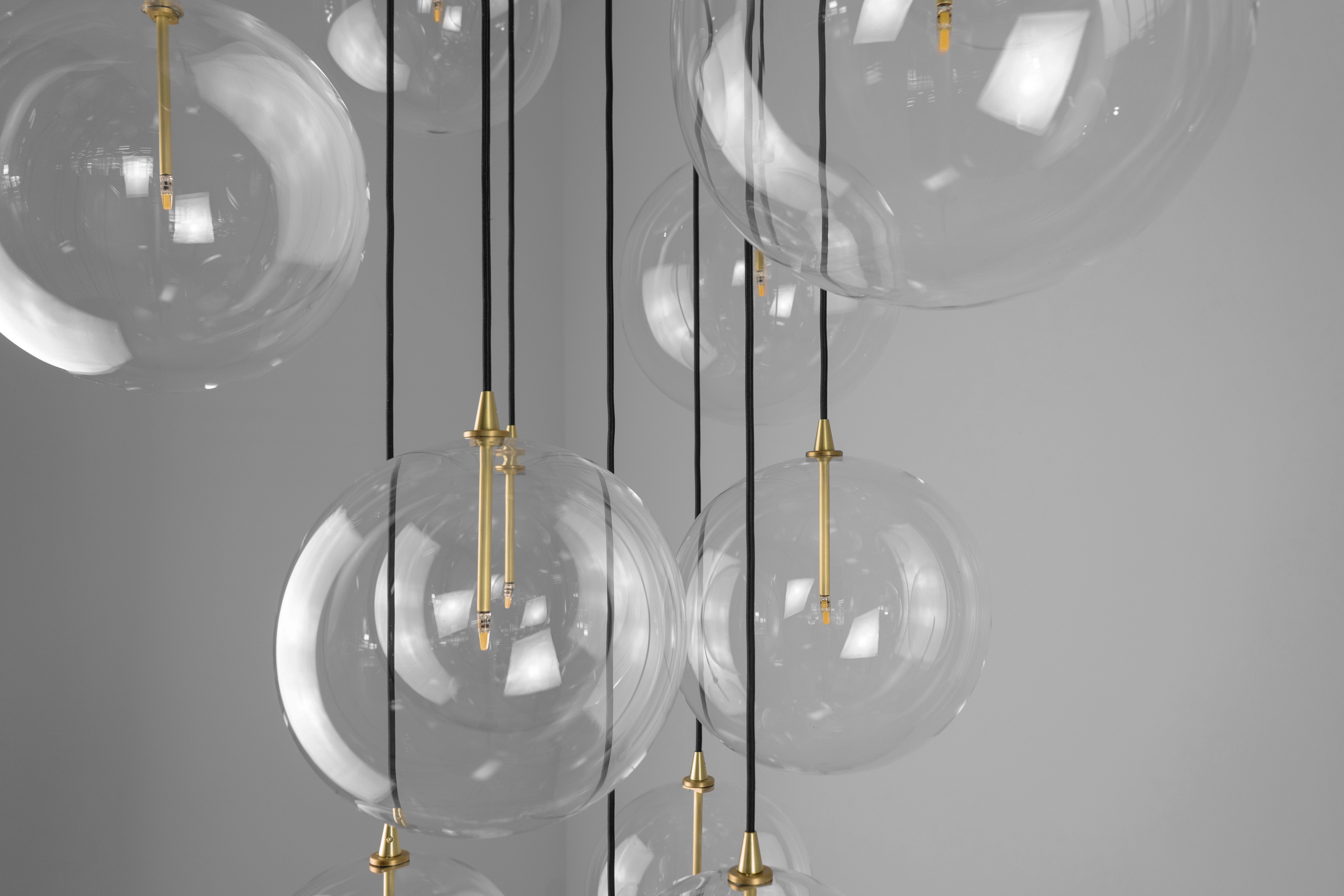 Schwung Cluster 13 Burnished Brass Transparent Globe Mix Chandelier