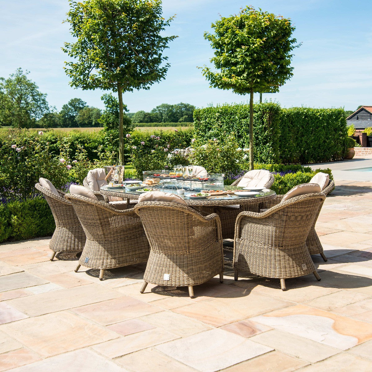 Winchester Brown Rattan Outdoor Oval Dining Set Fire Pit Table with Heritage Chairs | 8 Seater