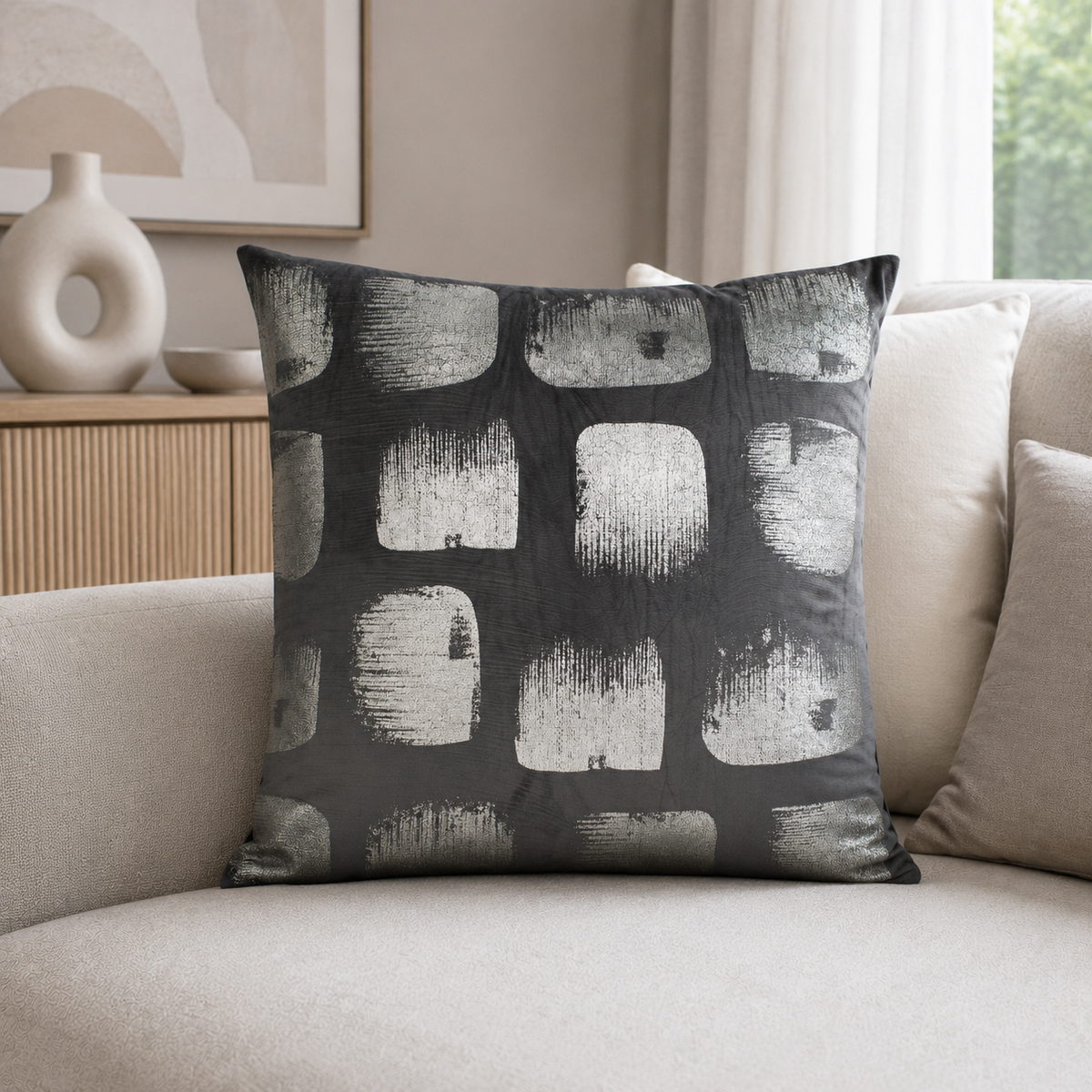 Malini Kyoto Abstract Squares On Grey Velvet Square Cushion styled on a neutral sofa