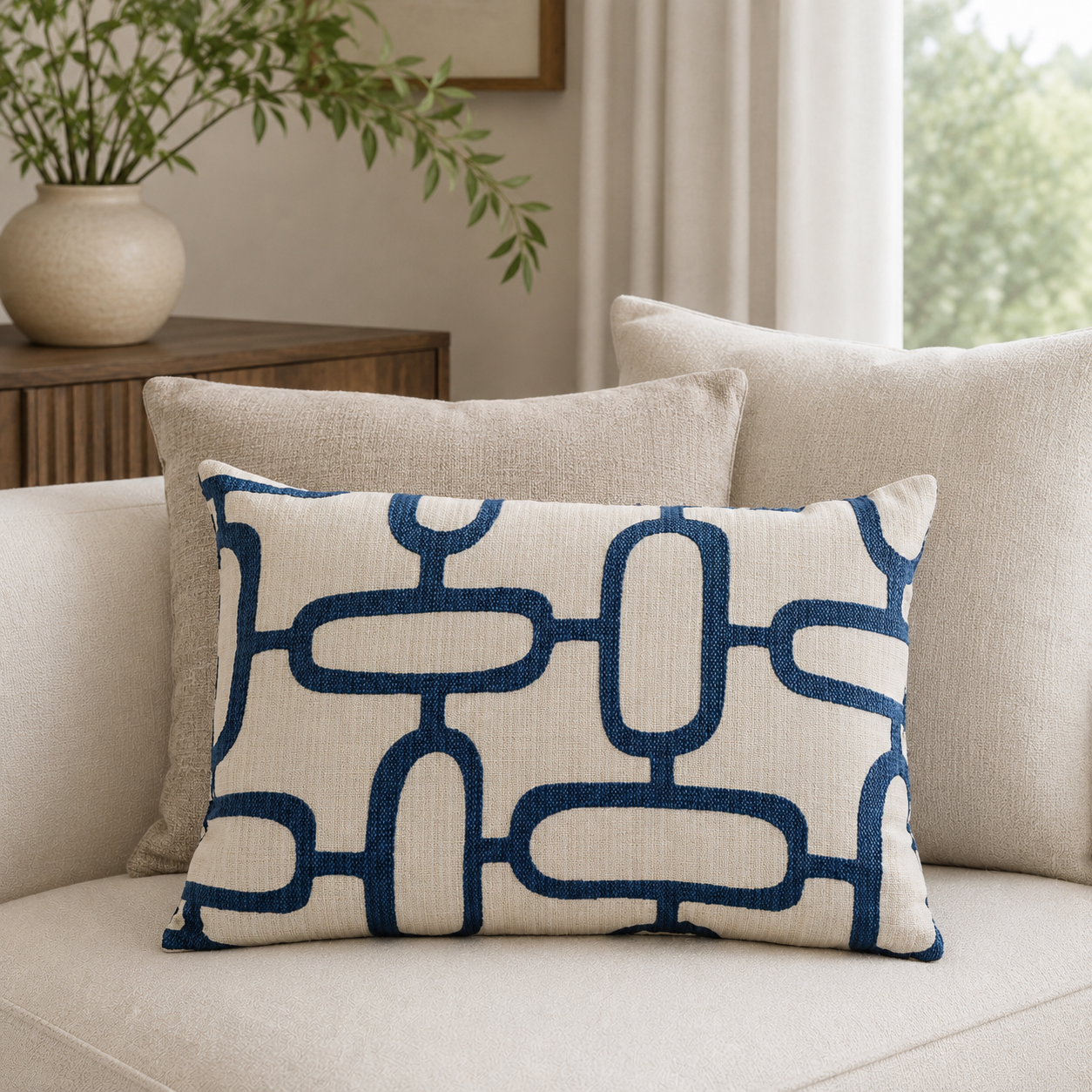 Malini Edison Abstract Chains Jacquard Blue Rectangle Cushion 40x60 styled on light neutral furniture