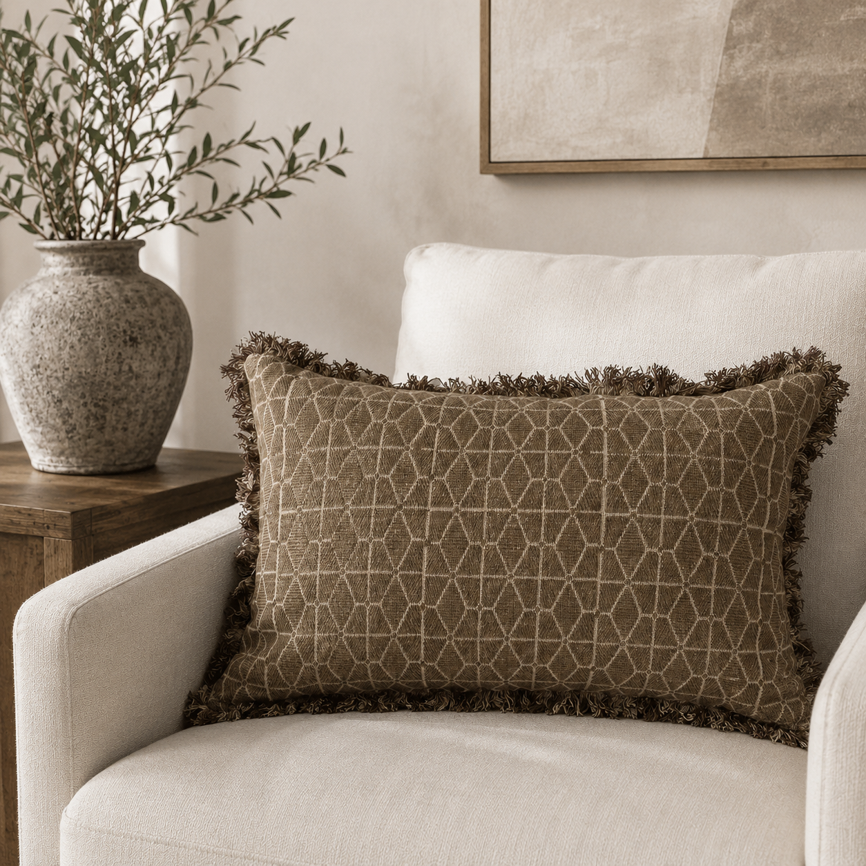 Malini Ravi olive green 30x50 rectangle cushion styled on a light neutral armchair