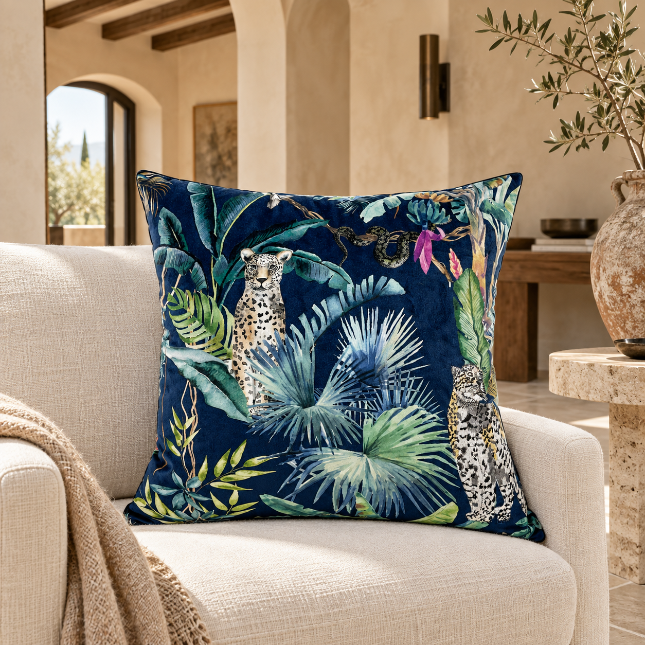 Malini Amigo leopard cushion in a refined Mediterranean salon
