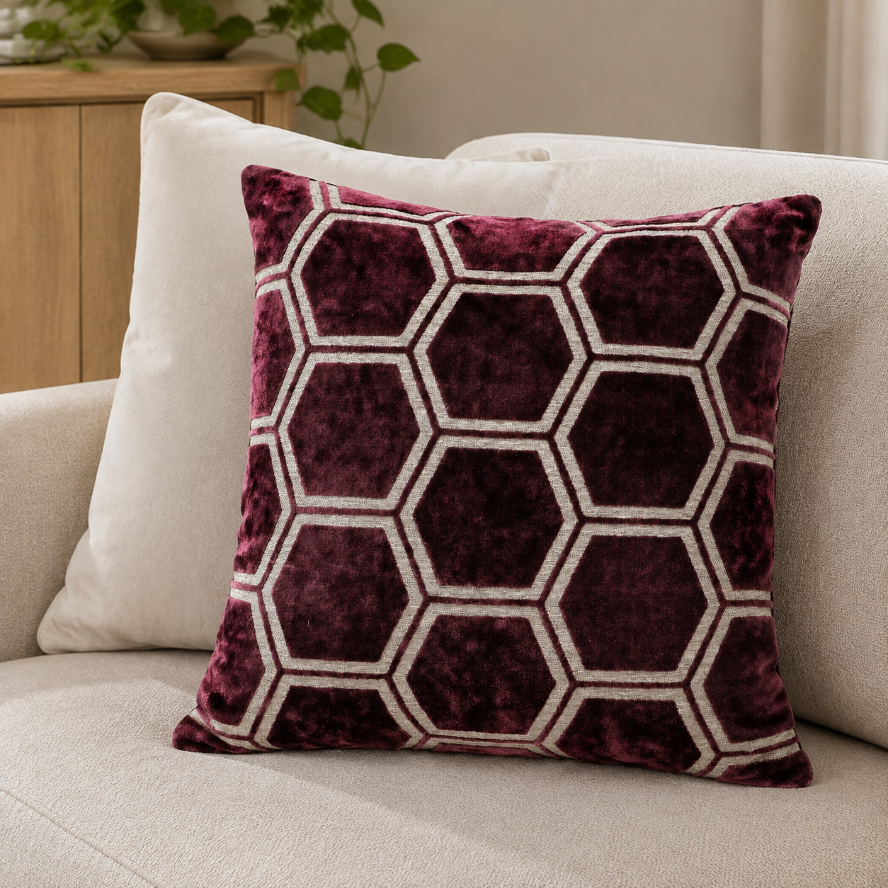 Malini Ivor aubergine hexagon velvet square cushion 43x43 in a neutral living room