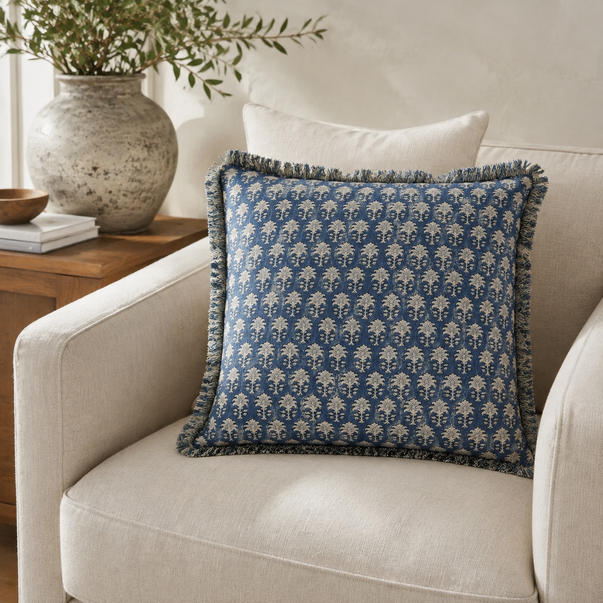 Malini Sarika indigo block print 45x45 cushion styled on a light neutral armchair
