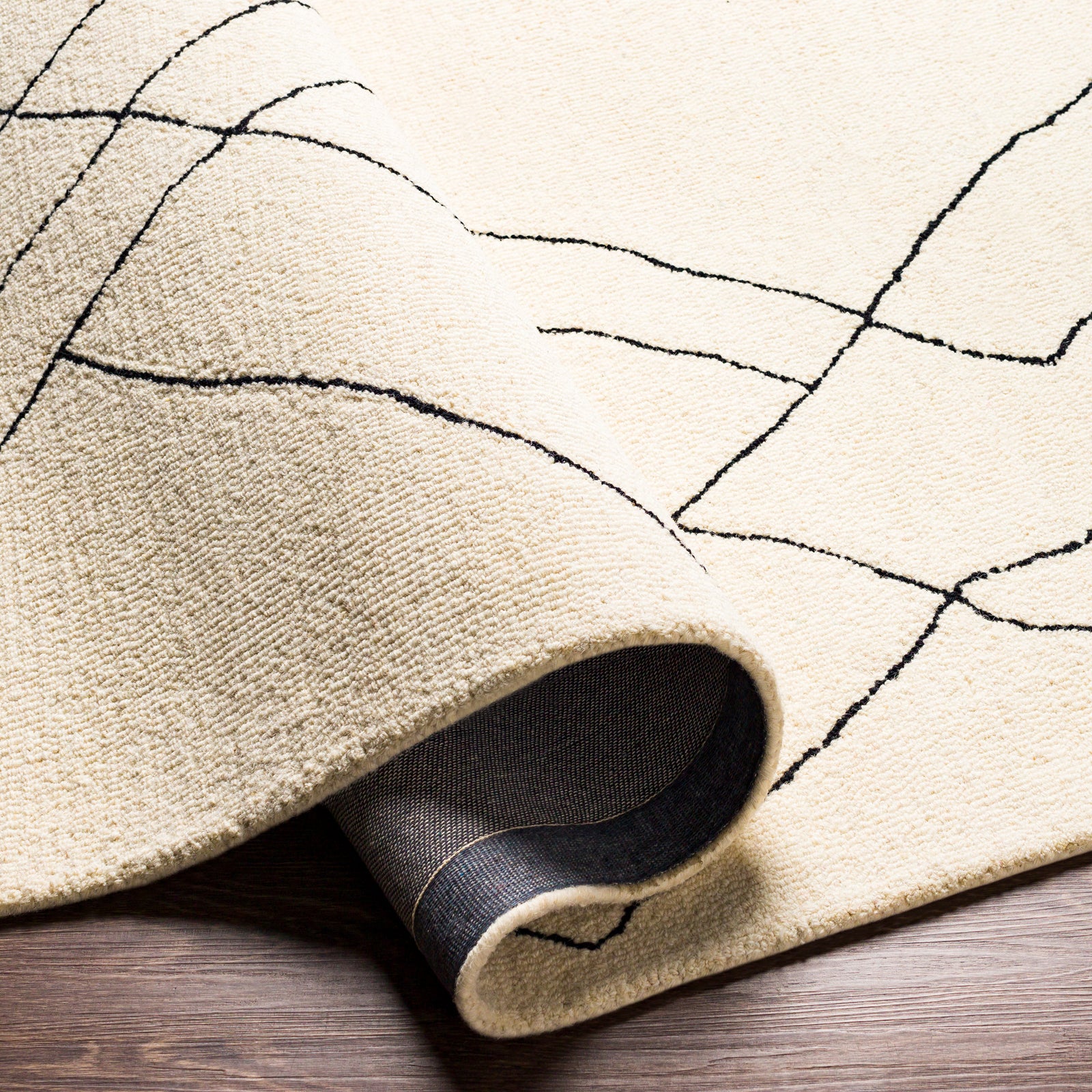 Arsenal Global Hand Tufted Wool Cream & Black Rug 183x274cm - folded detail