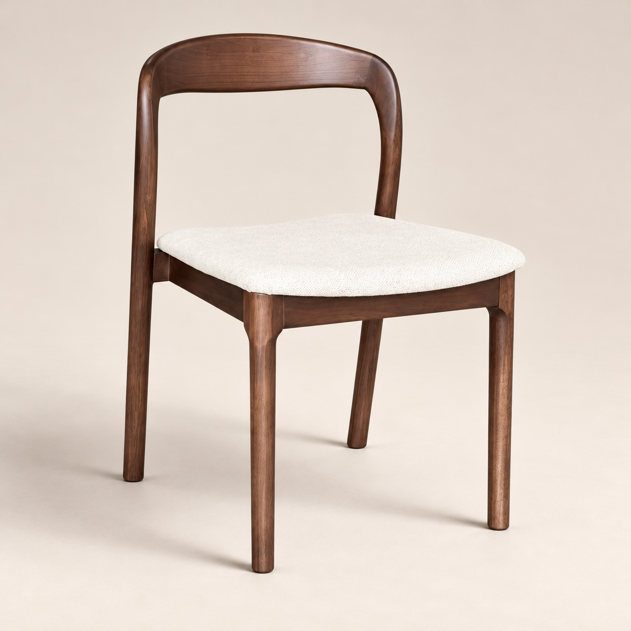 Oren Cream Boucle Dark Leg Dining Chair (Crib 5) on a warm neutral studio background