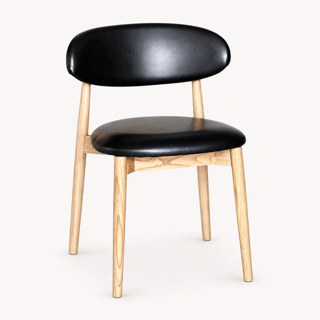 Elin Black Faux Leather Oak Dining Chair (Light Leg) on a pale off-white studio background