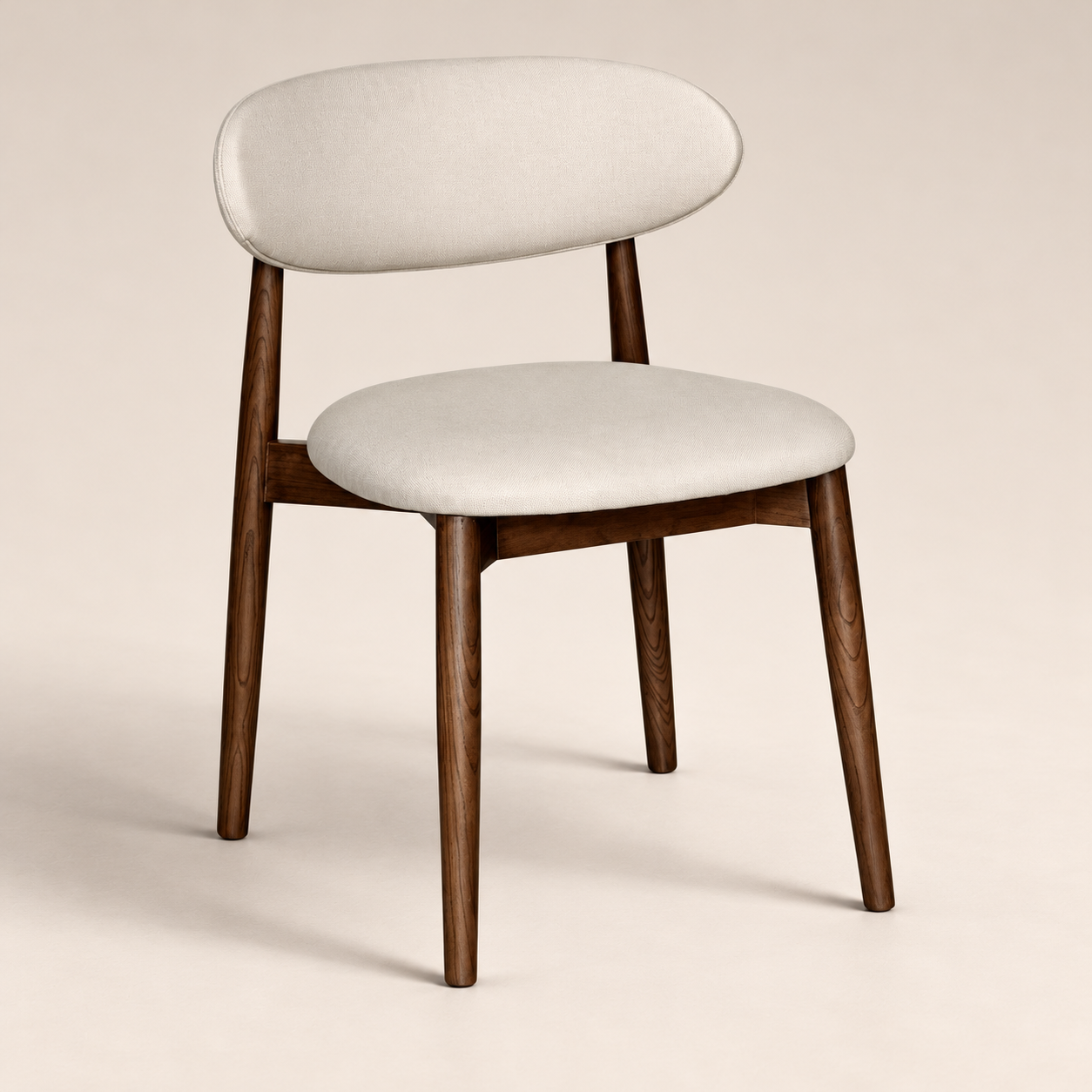 Elin Latte Fabric Dark Oak Leg Dining Chair on a warm neutral studio background