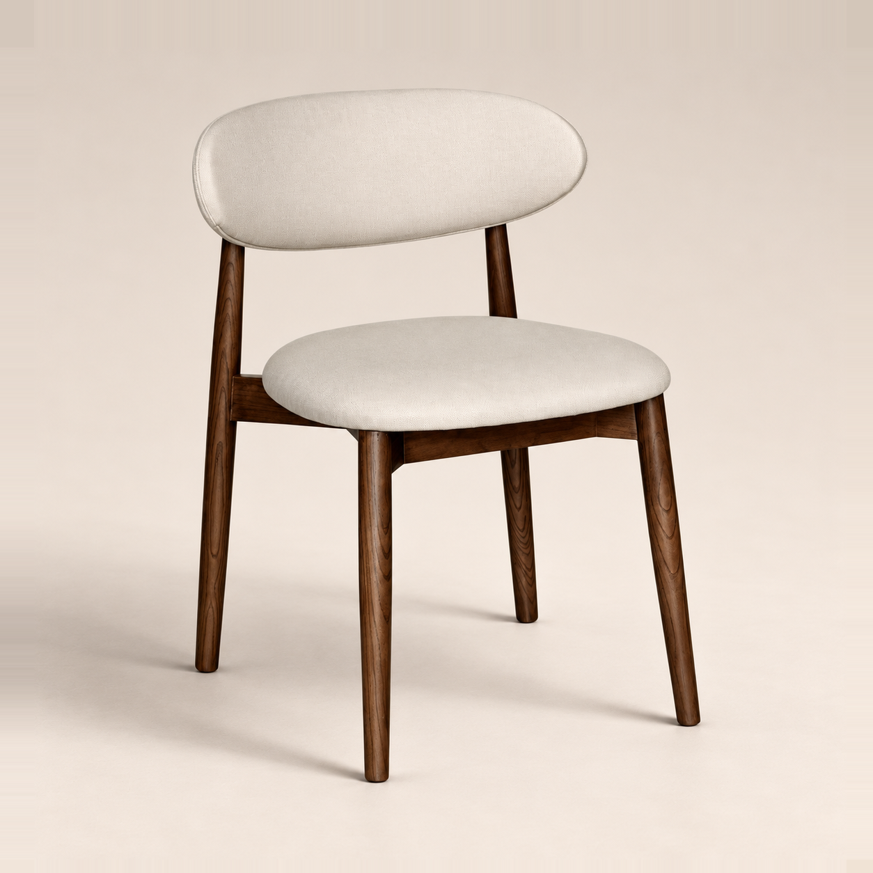 Elin Latte Fabric Dark Oak Leg Dining Chair on a warm neutral studio background