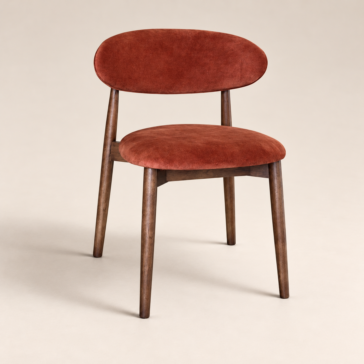Elin Orange/Rust Velvet Oak Dining Chair - Dark Leg on a warm neutral studio background
