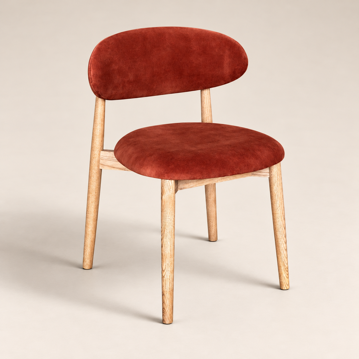 Elin Orange Rust Velvet Oak Dining Chair - Light Leg on a warm neutral studio background
