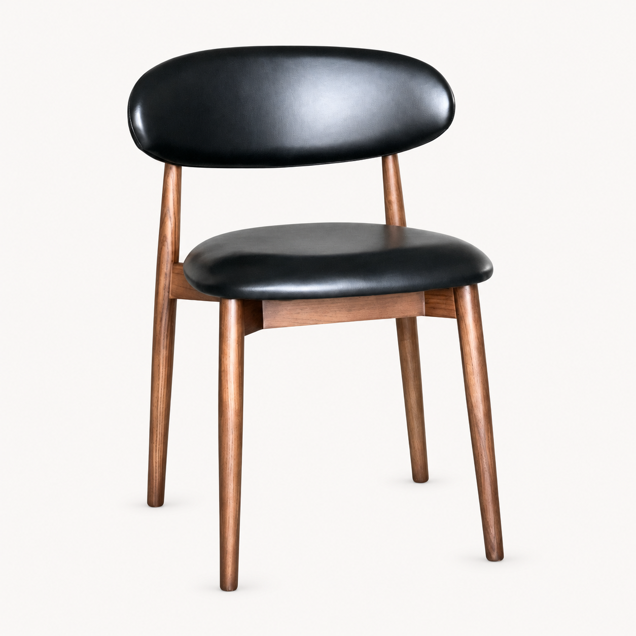 Elin Black Faux Leather Oak Dining Chair (Dark Leg) on a pale off-white studio background